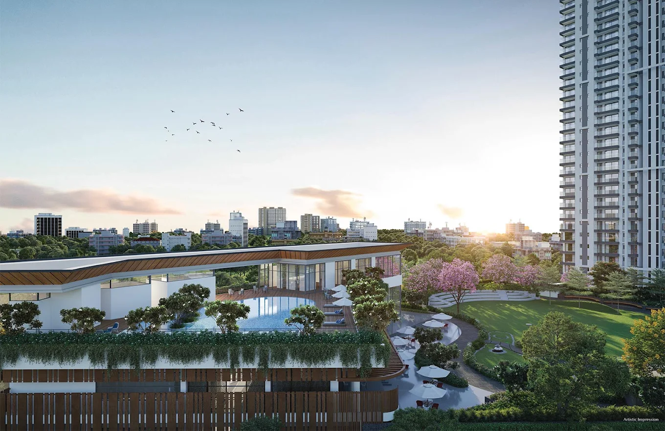 Tall modern buildings with blue sky and green trees in front